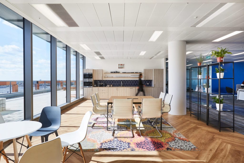 Light filled staff breakout area inside a health-tech workplace design and build project by AIS