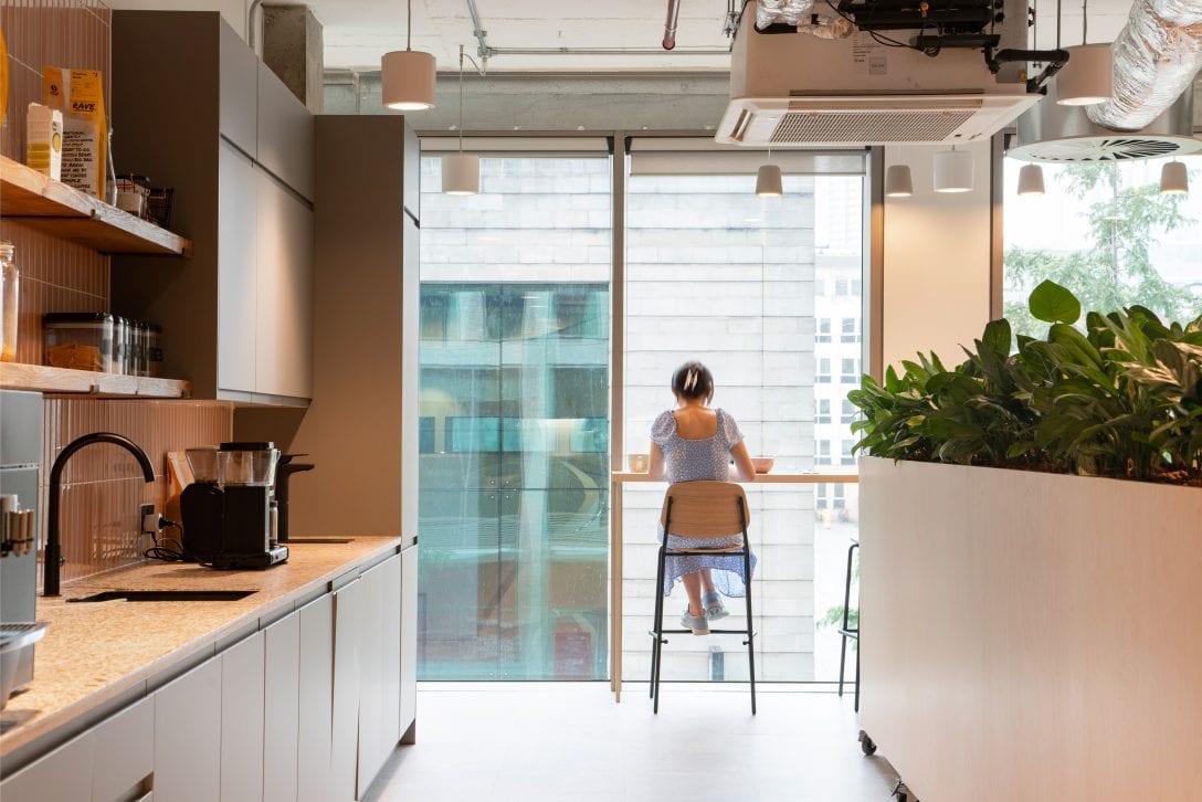 A woman is shown working on her own in a quiet work zone.