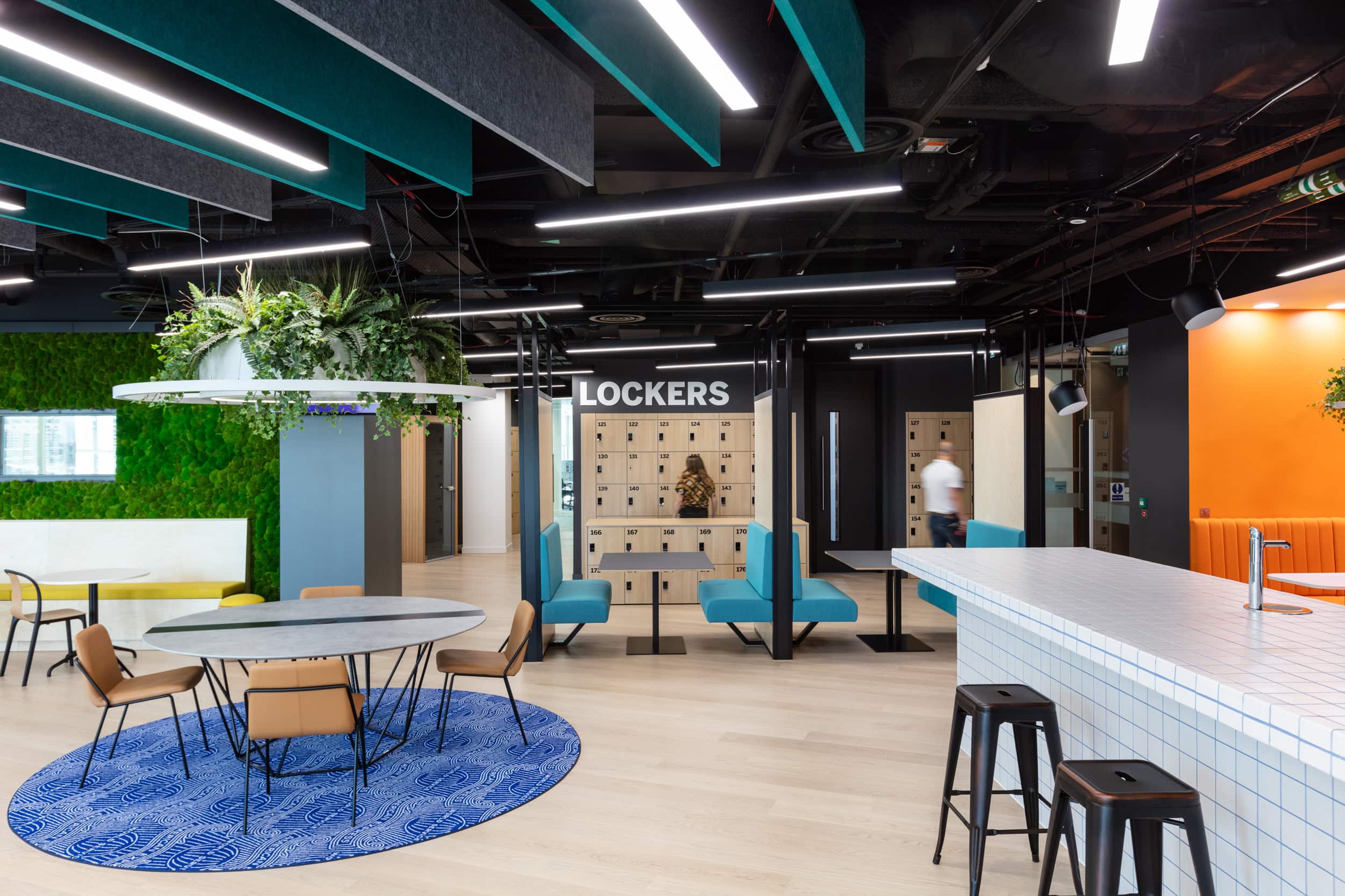 Staff are shown inside an office removing belongings from their lockers.