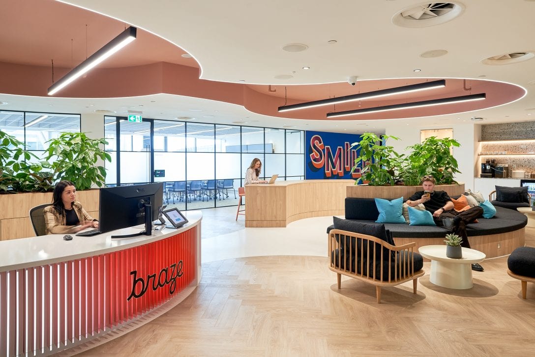 Clients wait in the reception area of Braze's office which was designed with a heavy focus on corporate branding.