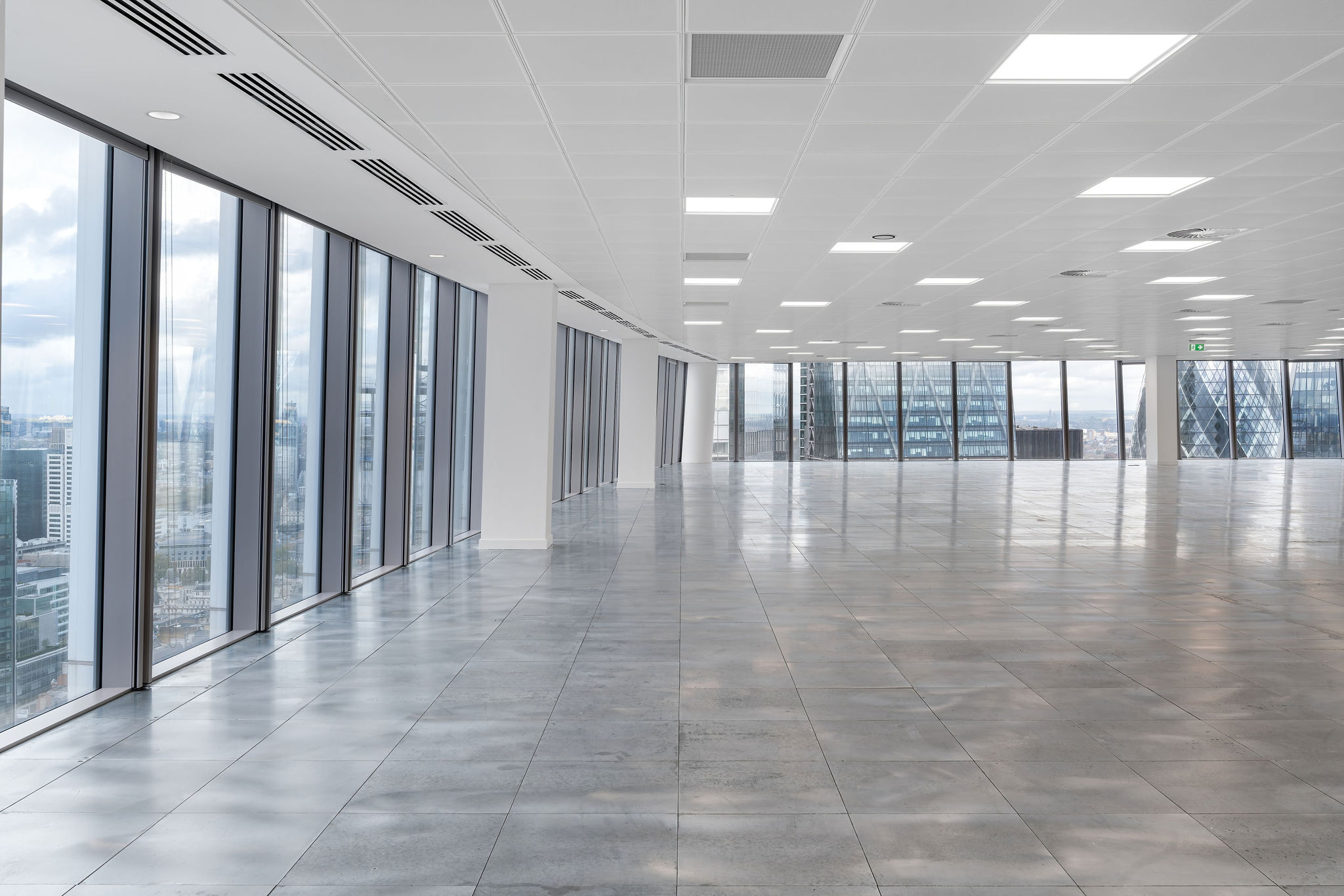 Spacious interior of an office space at 20 Fenchurch Street, featuring large windows and polished flooring.