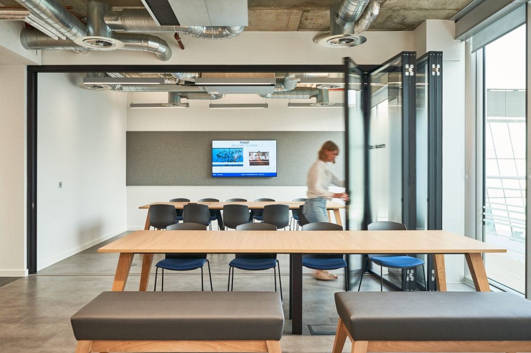 A girl is shown inside an agile meeting room with retractable walls. 